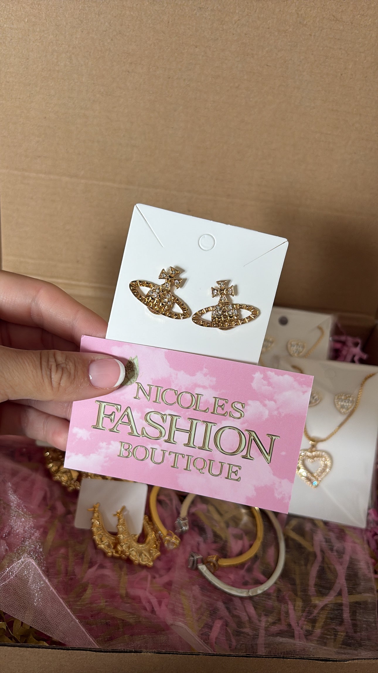 Gold planet earrings with logo